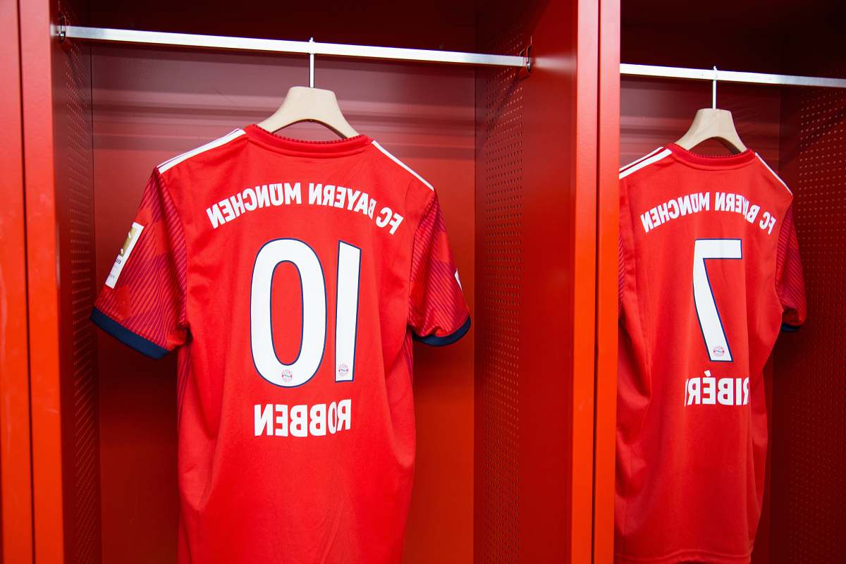 indoors red 10 Robben soccer jersey hanging room